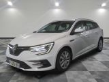 a white car is parked in a room with checkered floor