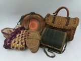 many different types of bags and purses on the table