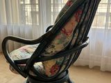 a chair that is sitting in front of a window