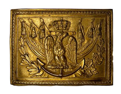 gold metal belt buckle with eagle and crown on it