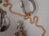 a lot of gold and silver jewelry on a table