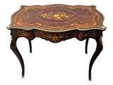 an image of a small table with a wooden top and ornate decoration