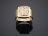 an 18k yellow gold ring set with diamonds