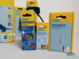 four boxes of staples and a stapler on the table
