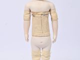 a small doll that is standing on a white surface