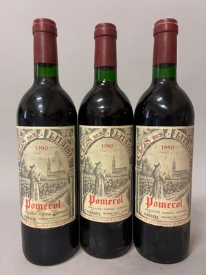 three bottles of wine sitting on top of a table next to each other
