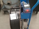 une image représentant une machine bleue équipée d'un tuyau