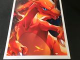 a close up of a picture of a red dragon with blue eyes