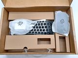 a box with a keyboard and a bag in it