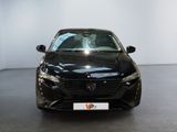 a black car that is parked in a showroom