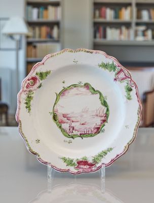 a plate that has a picture on it on a table