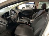 the interior of a car with a steering wheel and a dashboard