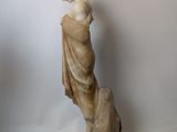 marble statue of a woman with a dog