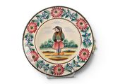 a decorative plate with a painting of a girl on it