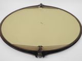 an image of a round mirror on a white surface with a brown frame