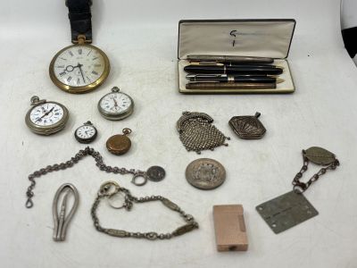 many different types of watches and other items on the table