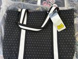 a black bag with white polka dots on it