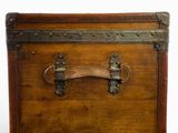a wooden trunk with a metal handle on a white background