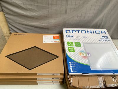 two boxes of electronics sitting on a table next to each other