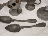 a lot of silver spoons and spoon spoons on a table