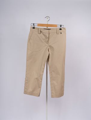 an image of a pair of beige pants on a stand