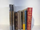 a lot of books that are sitting on a table
