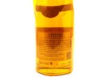 an image of a bottle of alcohol sitting on top of a white surface