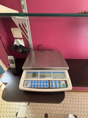 a scale that is sitting on a table in a room