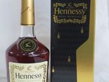 an image of a bottle of hennesy whisky next to a box