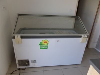 a freezer that is sitting in the corner of a room
