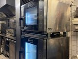 a kitchen with a lot of appliances in it