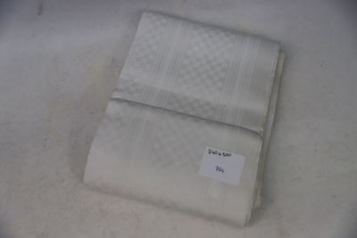 a white towel with a tag on it sitting on a table