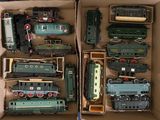 a lot of toy trains in a box on the floor