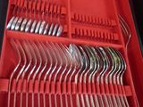 a red box with a set of forks and spoons in it