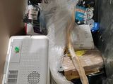 a box with a computer and other items in it