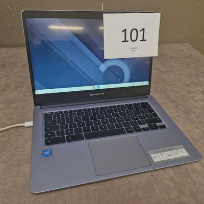 a laptop that is sitting on a table with a price tag on it