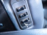 a close up of a car ' s dashboard with four buttons