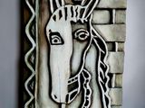 painting of a horse on a wall with a brick wall in the background