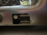 a close up of a metal object with a sticker on it
