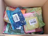 a cardboard box filled with assorted colored items