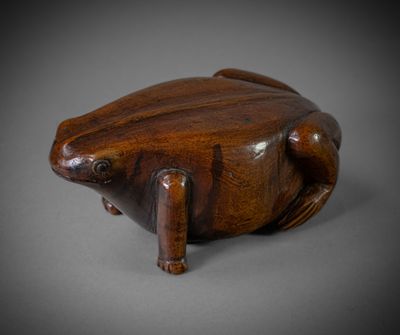 an image of a wooden frog sitting on top of a table