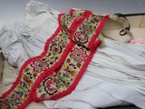 a white shirt and a pink scarf in a suitcase