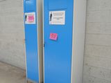 two blue lockers next to each other on the side of a building