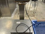 an image of a scale sitting on top of a metal table