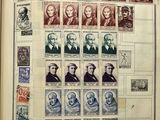 an open book with a bunch of stamps on it
