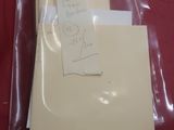 two envelopes and a piece of paper on a red cloth