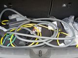 a bunch of wires in the trunk of a car