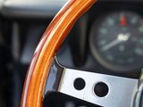 a steering wheel and a clock in a car