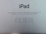 an apple ipad sitting on top of a table next to a laptop computer