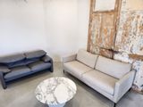 two couches and a coffee table in a room